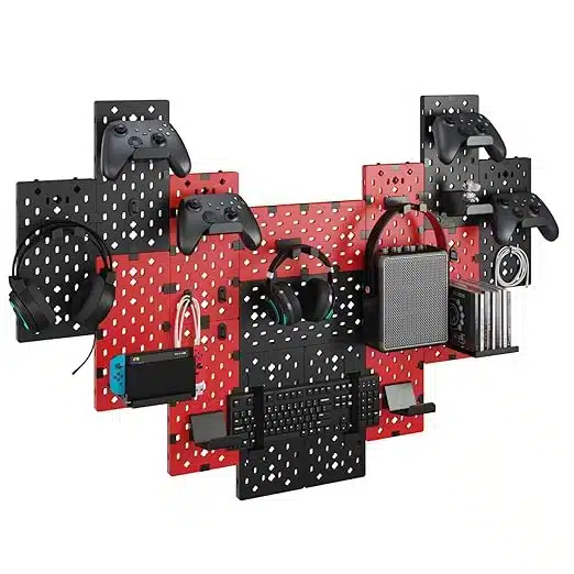 Modular gaming pegboard with wall mounts for controllers, headphones, and game discs in black and red